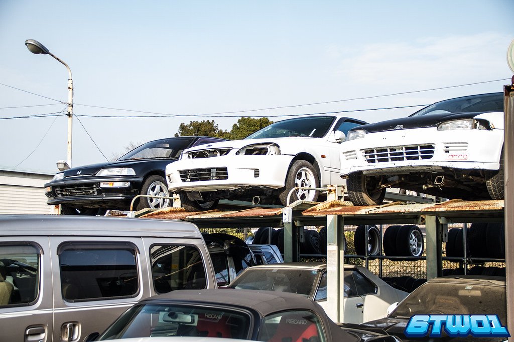 black and 2 white cars
